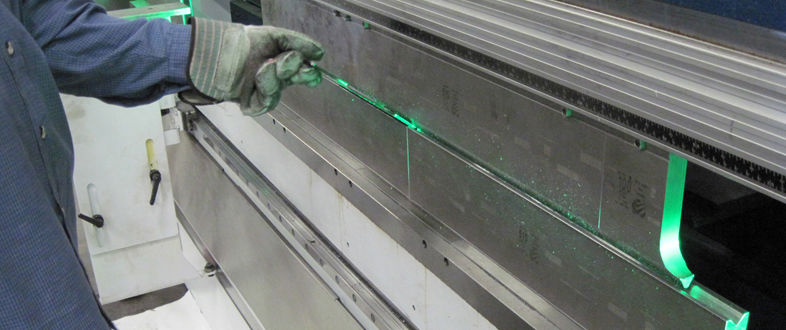 Operator positioning sheet metal in a press brake